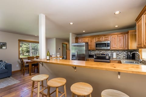 Bar, kitchen, and dining area