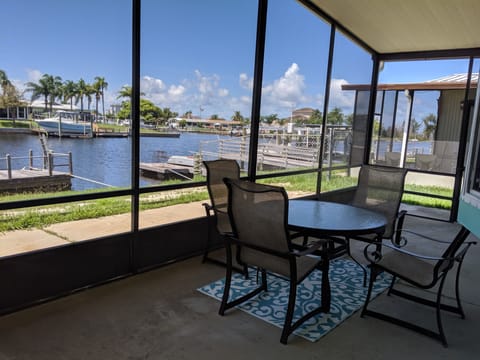 Screened in lanai with dinning/relaxing. 
Entry & laundry building also scre
