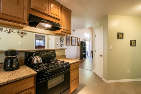 Granite counters/maple cabinets. Drip coffee maker and NM Pinion coffee provided