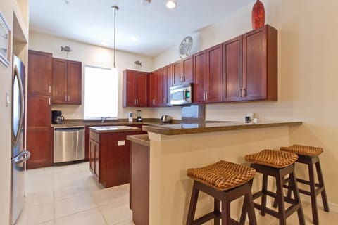 Our kitchen boasts full size appliances, center island, and breakfast bar for 3.