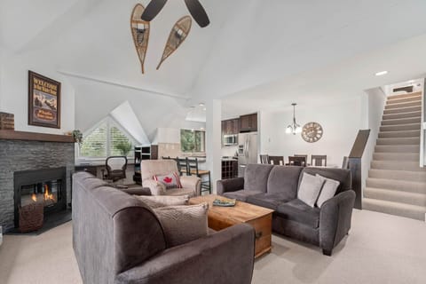 Vaulted ceilings and a cozy wood-burning fireplace create the ultimate mountain retreat