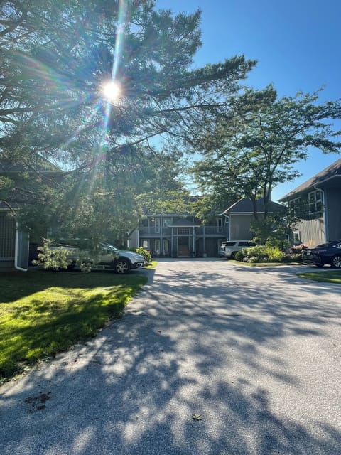Entry driveway to condominium. Guest parking is to the right