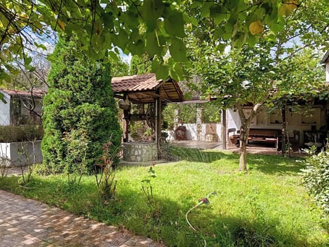 Outside lawn and a dining area that sits eight