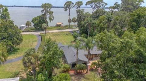 Drone shot of house and lakeside dock