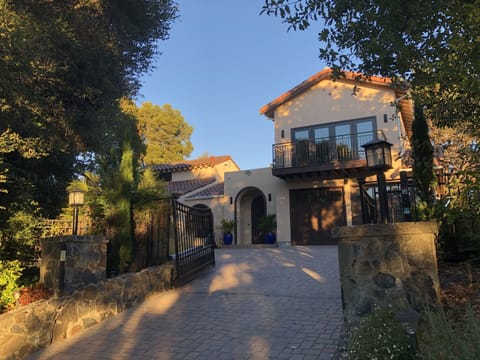 front of house with large driveway. Additional parking across the street