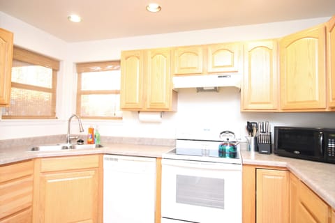 Kitchen has a toaster, blender, crock-pot, microwave and a drip coffee maker