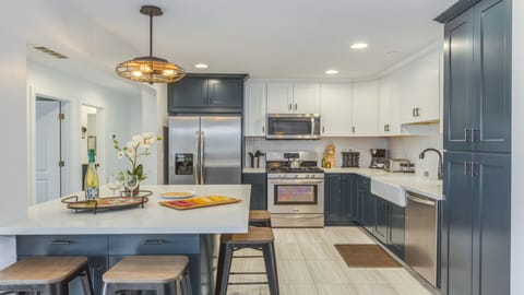 - Sleek kitchen with stainless appliances and farm sink   - Spacious counters and cabinets for every cooking need   - Stylish layout designed for hosting and family meals
