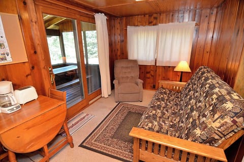 Living room.  Sliding glass door opens onto the screened porch.
