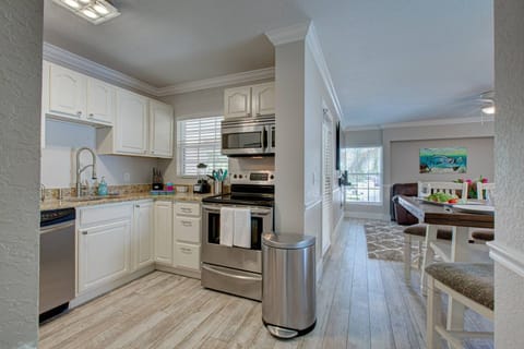 Lovely full kitchen with granite counters and stainless appliances.