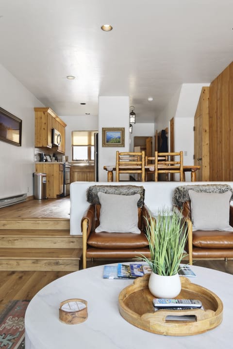 Living room opening to the dining area - The murphy bed is located in the cedar built in located in the dining room shown in this image.