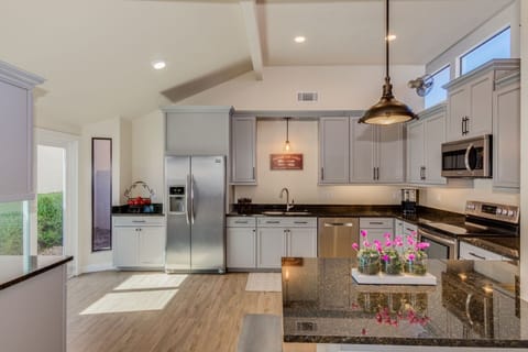 Oversized NEW kitchen with sliding glass door to enclosed patio