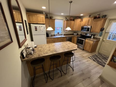 Fully stocked kitchen with new appliances.