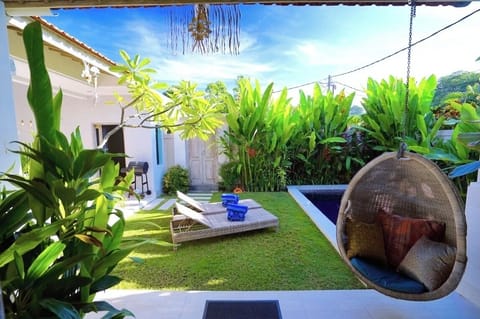 The villa's beautiful garden, with a grass play area for kids and private pool