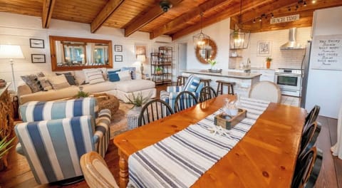 The family room area features a large sectional with cozy arm chairs for relaxing after a day at the beach.