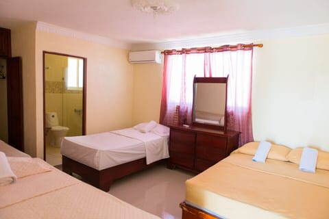 Air conditioned One bedroom apartment with 3 single beds and 1 double large bed