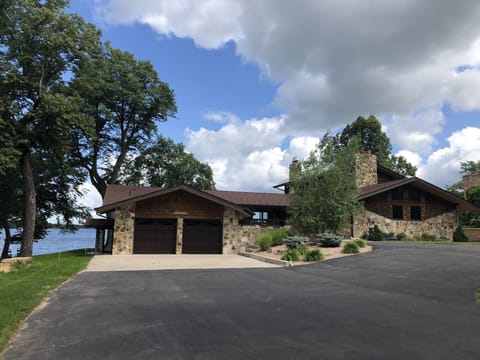 Large, private driveway with access to garage for parking bikes and water toys.