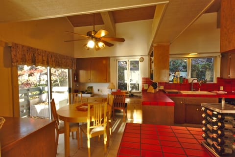 The kitchen area includes a breakfast nook that seats four.