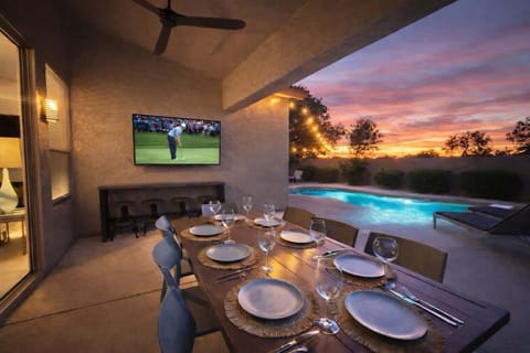 65 in smart TV and seating for 10 to grill and relax by the pool.