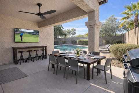 65 in smart TV and seating for 10 to grill and relax by the pool.