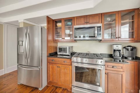 Kitchen with wooden cabinets and stainless steel appliances