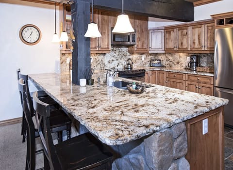 Kitchen counter with bar and seating for 4