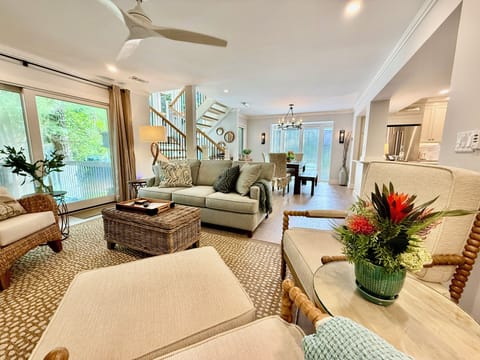 Beautiful living area opening to dining and the sliding door to the deck