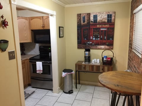 Coffee station and pub table to enjoy a meal or get some work done.