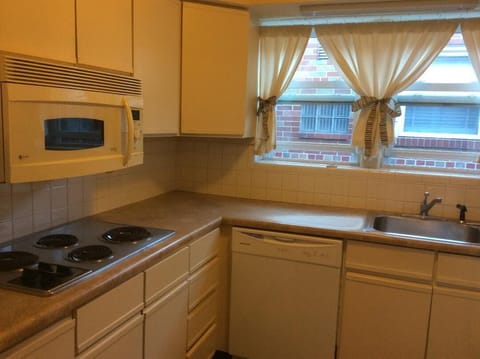 Fully stocked galley kitchen: stove, oven, microwave, dishwasher, all utensils