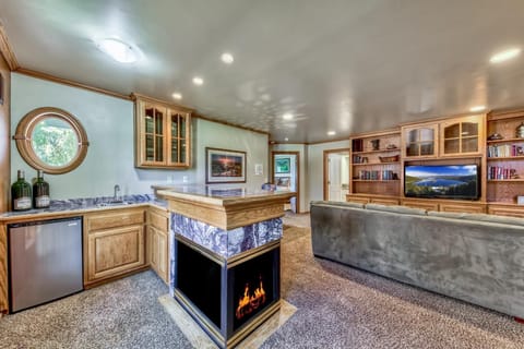 This bonus living area even has it's own gas fireplace and large HDTV