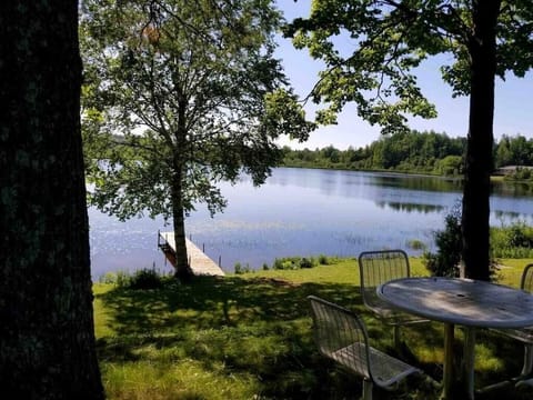 Stunning lake views from the back porch, perfect for morning coffee or evening sunsets! Private dock and 12' rowboat included with rental