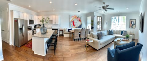 Living room and kitchen.  Can see TV from kitchen.
