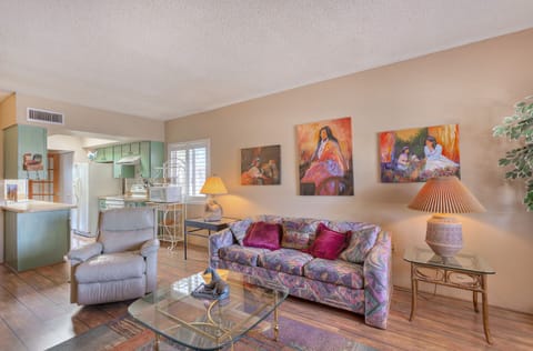 Queen hide a bed. Spacious living room with two chairs and sofa.