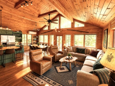 The heart of the house! Spacious great room with comfy seating, dining for 8 + 4