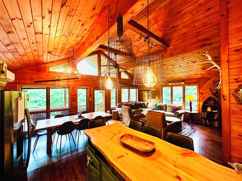 View from kitchen to wrap around porch and seating areas. Air conditioning here.