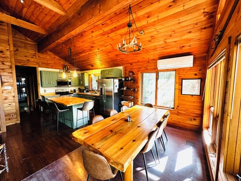 View of kitchen table and kitchen and kitchen island.