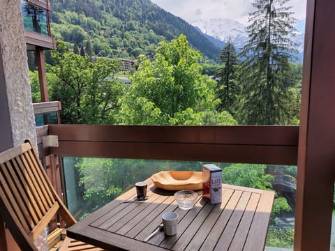 Furniture, Table, Property, Plant, Mountain, Sky, Wood, Outdoor Furniture, Tree, Shade