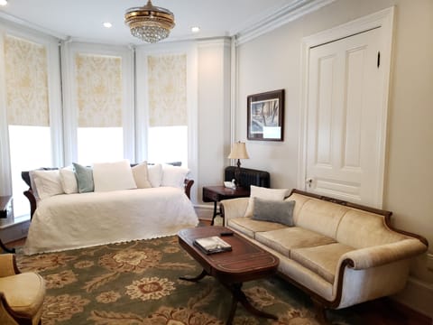 Living room has a trundle bed, automatic black-out blinds and a 55" smart TV.