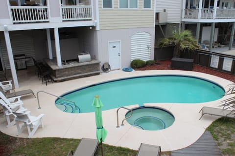 Pool.  Lots of poolside seating.  Stone bar with built-in grill under deck. 