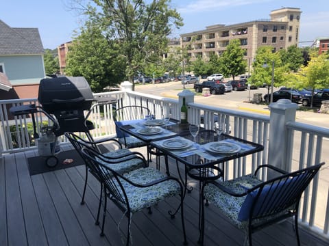 Outdoor deck with gas grill and view over downtown 