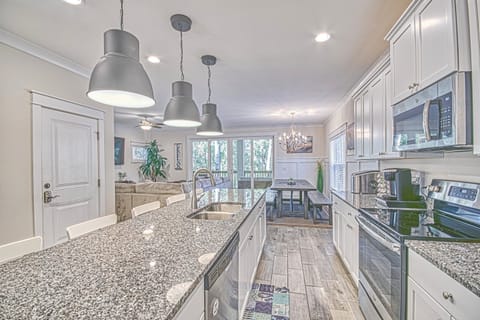 Luxury Kitchen & Dining Room overlooking living room. Huge Island with seating.