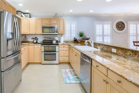 Large Galley Style Kitchen with New Stainless Steel Appliances