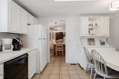 Kitchen has a drip coffee maker and keurig coffee maker
