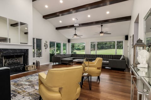 Beautiful Living Room with custom leather sofa that seats up to 20 guests. 