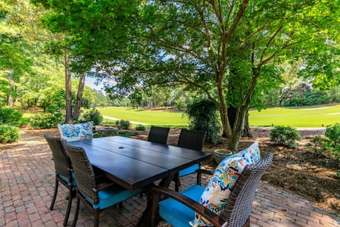 Stunning backyard w/ 4 outdoor sitting areas w/ views of lush fairways & Green