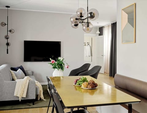 Spacious and bright living room with a comfortable sofa bed.