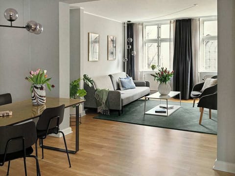 Spacious and bright living room with a comfortable sofa bed