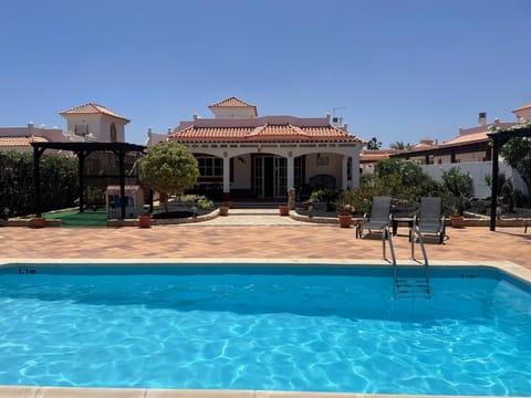 Rear View Of House and Pool
