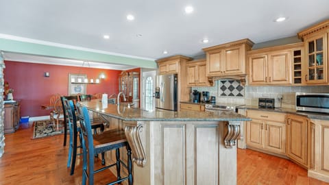 Large open Kitchen with huge granite top island. 