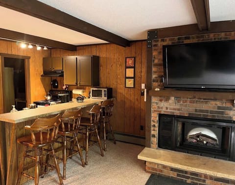 Unwind with Roku entertainment and the glow of an electric fireplace.