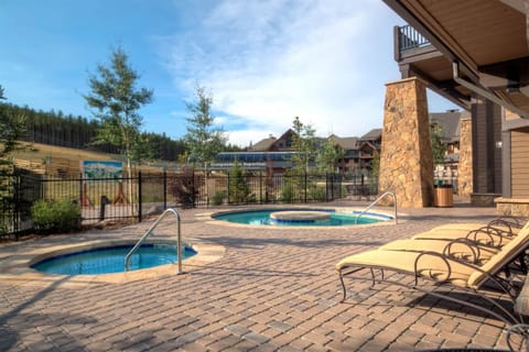 Relax in a slope-side hot tub at Crystal Peak Lodge